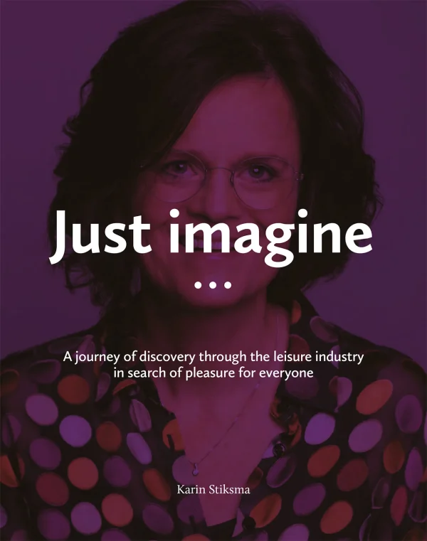 The cover of a booklet with a happy woman with glasses and dark brown hair. She is wearing a transparent blue silk blouse with large dots in different colours: white, brown, rust brown. On the front it reads: Imagine… A journey through the leisure industry on the way to fun for everyone.