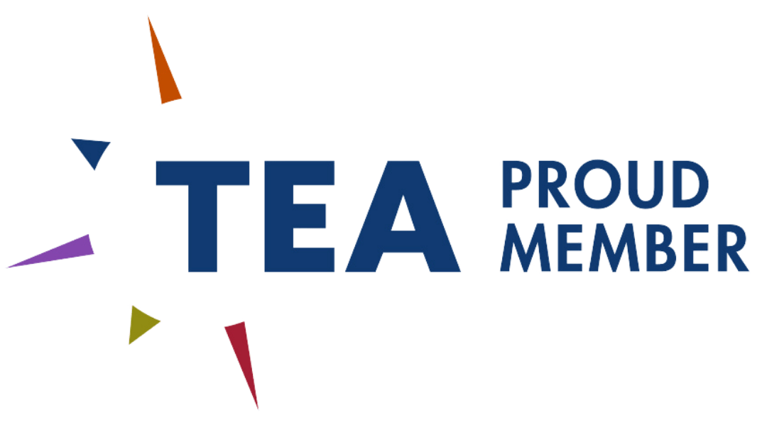 The name TEA is surrounded by five different types of colored flashes.
Behind it is Proud member.